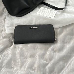 Calvin Klein Black Leather zippered wallet with silver accents